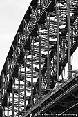 australia stock photography | Sydney Harbour Bridge Details in Black and White, Sydney, New South Wales (NSW), Australia, Image ID AU-SYDNEY-HARBOUR-BRIDGE-0218. Silhouette of the beautiful Sydney Harbour Bridge steel structures in Sydney, NSW, Australia. The Sydney Harbour Bridge is a steel structure, with the steel arch carrying the live and dead loads out to the concrete abutments (skewbacks).