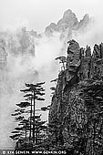 portfolio stock photography | Huangshan Mountains in Clouds, Xihai (West Sea) Grand Canyon, Baiyun Scenic Area, Huangshan (Yellow Mountains), China, Image ID CHINA-BW-0004. According to the Chinese saying - 'You won't want to visit any other mountains after viewing the Five Mountains, and you won't even want to visit them after you come back from Huangshan.' Since the Tang Dynasty, Huangshan has been immortalized in art, literature and religion, particularly in the mountain and water style paintings of the 16th century. Huangshan is famed for its 'cloud seas,' which surround the peaks creating 'islands' from the mountains tops.