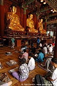  stock photography | In Prayer for Buddha Inside Jogyesa Temple in Seoul, South Korea, Gyeonji-dong, Jongno-gu, Seoul, South Korea, Image ID KR-SEOUL-JOGYESA-0011. 