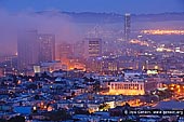 usa stock photography | San Francisco in Fog, San Francisco, California, USA, Image ID US-SAN-FRANCISCO-0003. San Francisco city lights and fog over San Francisco Bay at sunset as seen from the Corona Heights Park, California, USA. Corona Heights Park is often overlooked in favor of the taller near-by hills of Buena Vista and Tank Hill. This former quarry has stunning 360-degree views of the city and offers a unique vantage point not seen on some of the taller hills.