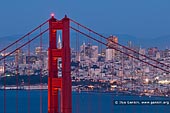 usa stock photography | Thread the Needle - The Golden Gate Bridge, San Francisco Bay, California, USA, Image ID US-SAN-FRANCISCO-GOLDEN-GATE-0002. 'Thread the Needle' is the iconic photo the Transamerica Pyramid seen through the north tower of the Golden Gate Bridge in San Francisco, California, USA at night.