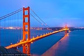 usa stock photography | The Golden Gate Bridge after Sunset, San Francisco Bay, California, USA, Image ID US-SAN-FRANCISCO-GOLDEN-GATE-0005. The Golden Gate Bridge in San Francisco Bay, California, USA after sunset when the entire landscape (bay and hills) is painted with blue light and only the bridge is highlighted with orange vermillion color. Seen from the Battery Spencer.